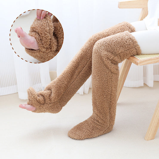 Brown over-the-knee fuzzy socks, worn sitting on a chair