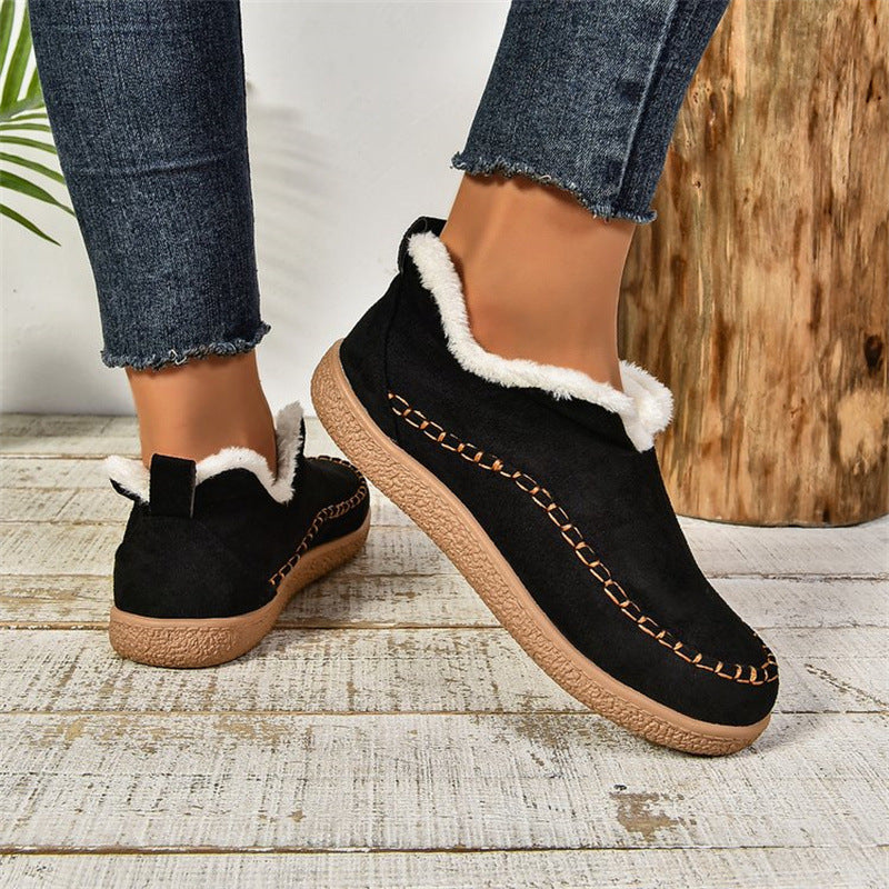 Black fleece-lined slip-on ankle booties, worn