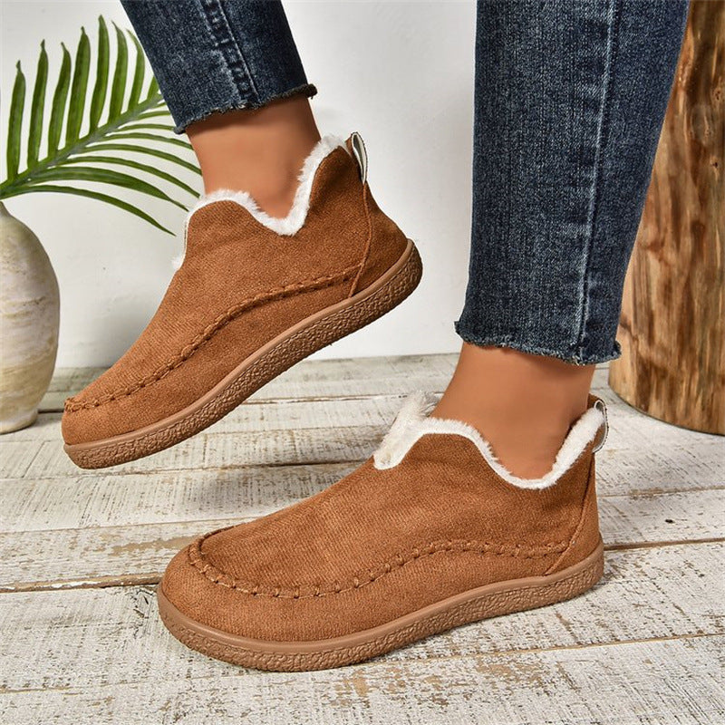 Light brown fleece-lined slip-on ankle booties, worn