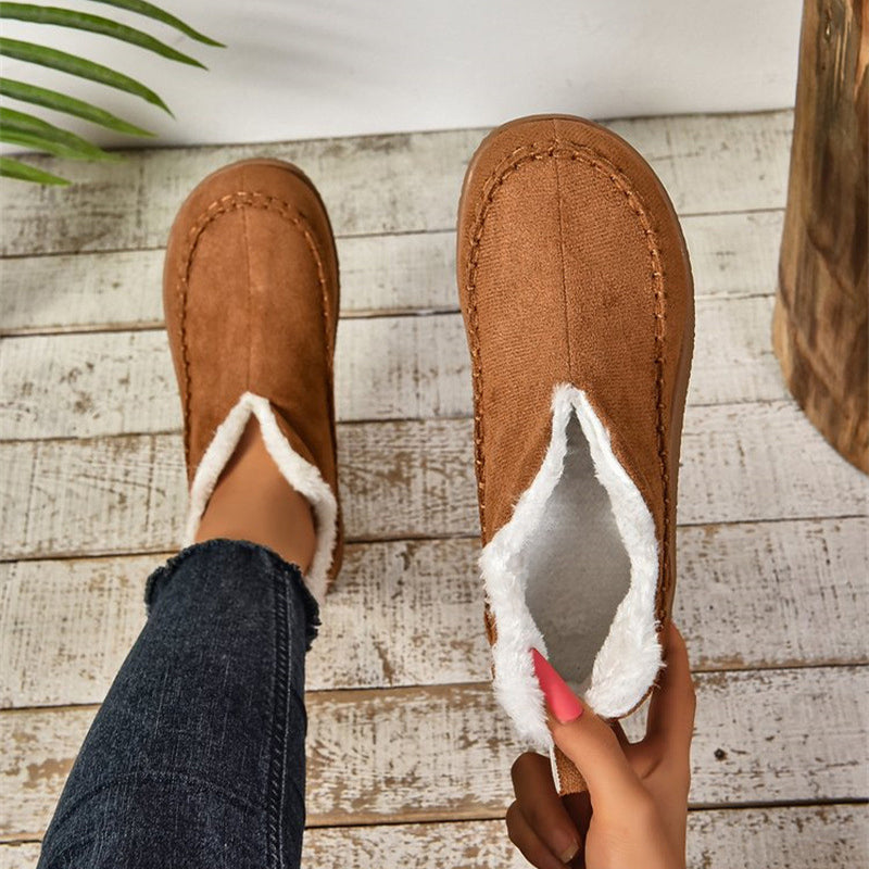 Fleece-lined slip-on ankle booties showing the plush lining