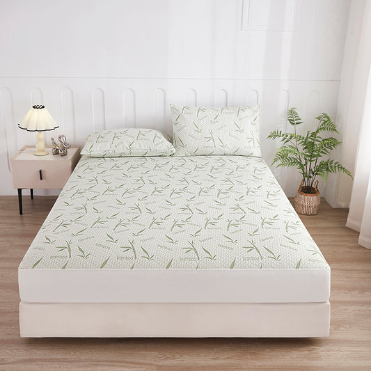 Bamboo fitted sheet with leaf print on a bed