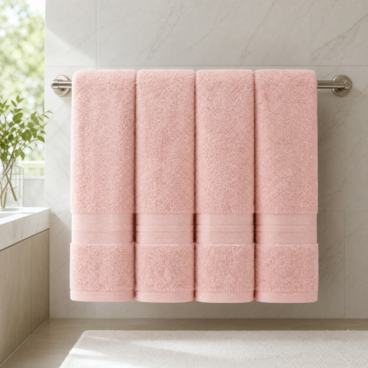 Set of 4 extra large bath towels in a bright bathroom