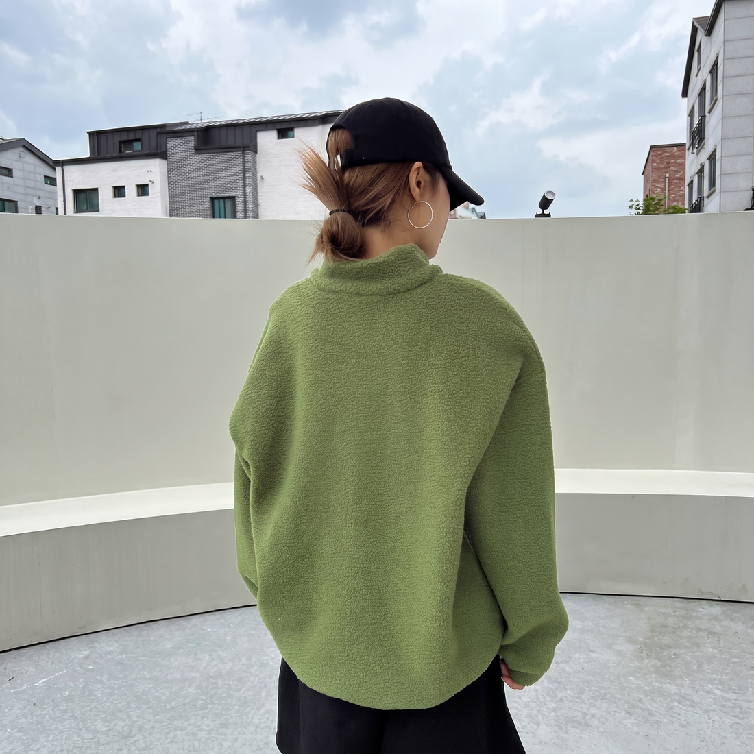 Lime green half zip fleece pullover, back view